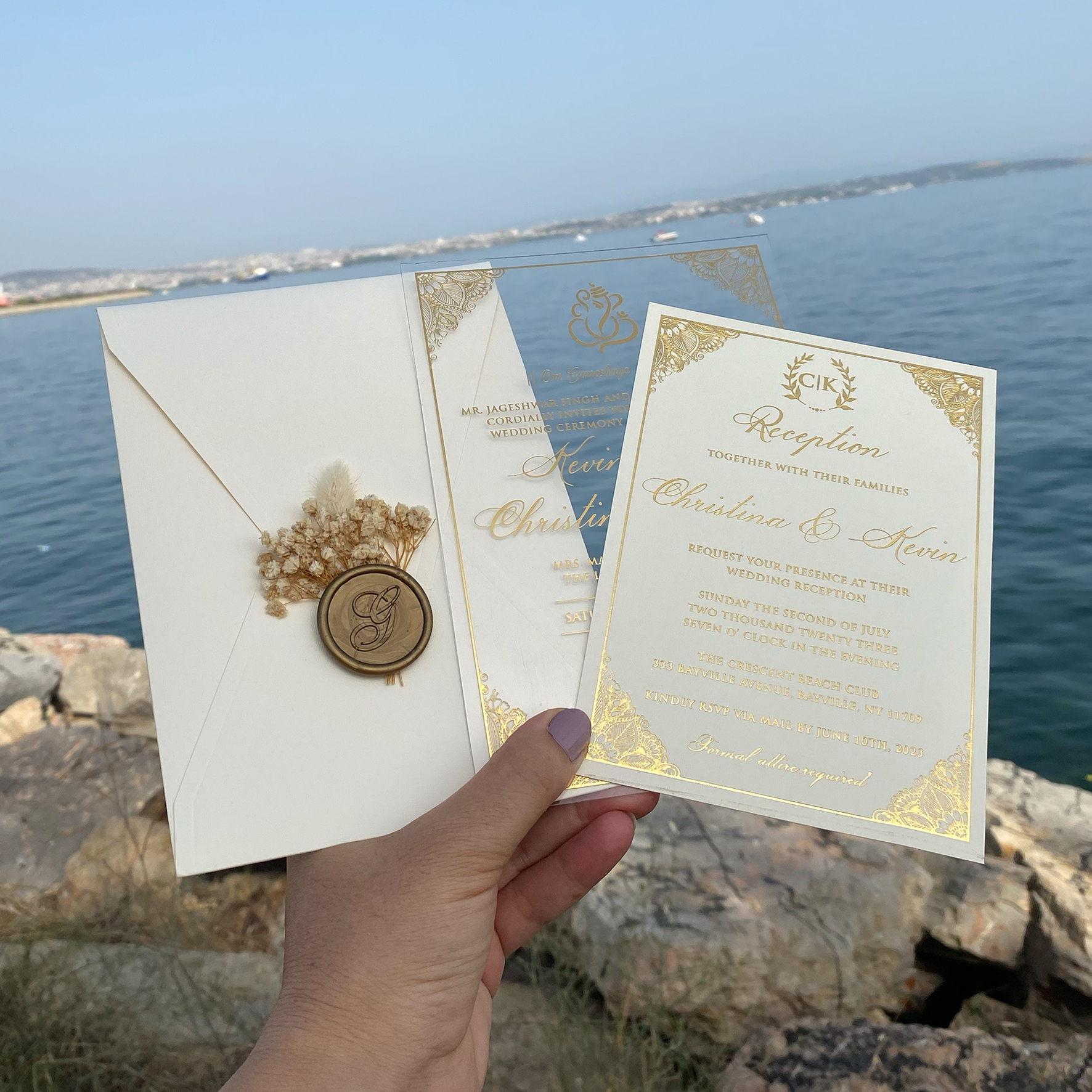 Acrylic Indian wedding invitation. Clear acrylic wedding invitation. Ivory envelope. Gold foil print. Wax seal and dried flowers.